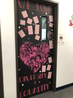 a door decorated with pink and black paper hearts, handprints and family pictures