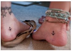 a woman's foot with an anchor tattoo on her ankle and two other feet