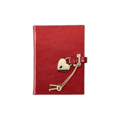 a red notebook with a heart shaped key attached to the cover and a clip on it