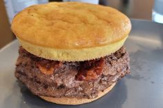 a close up of a hamburger on a plate