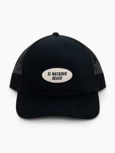 El Matador Beach Trucker Hat - 5-Panel Trucker Hat - Features "EL MATADOR BEACH" Patch Beach Trucker Snapback Hat With Short Brim, Beach-style Trucker Hat With 5-panel Design, Black Beach Season Hats, One Size Fits Most, Black Hat For Beach Season, One Size Fits Most, Beach Trucker Hat With Short Brim, Black Trucker Hat For The Beach, Trucker Snapback Hat With Curved Brim For Vacation, Black Snapback Trucker Hat For Beach, Black Trucker Hat Baseball Cap For Travel