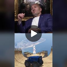 a man in a blue suit is talking to an image of a monster truck on the screen