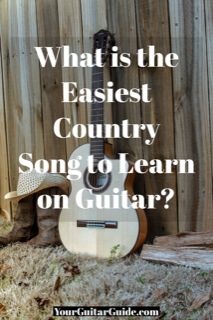 an acoustic guitar sitting in front of a fence with the words what is the easier country song to learn on guitar?