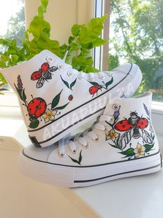 "-🐞BOHO LADYBIRD🐞- 🌈DESCRIPTION: You will receive a unique pair of shoes which I will personally paint by hand just for you.  I create your shoes from scratch by hand in my little studio. The main design is painted on the outside of the shoes only, while on the inside the shoes are painted with the same minimalist decorations to match with the outside. 🔥UNIQUE: As the shoes are PAINTED BY HAND, the design may slightly vary from the picture. Each design is unique in its own way. 🎨CUSTOMISE THEM: As the shoes are made to order, feel free to make them even more unique. In fact it is possible to customise them, adding a text, a date or a name on the inside of the shoes or even in the corner, on the outside next to the characters. Simply leave me a note at the checkout with the details you Hand Painted White Custom Sneakers For Summer, Hand Painted White Low-top Canvas Shoes, Artsy Hand Painted White Custom Sneakers, White Hand Painted Low-top Canvas Shoes, Artistic White Canvas Sneakers, White Hand Painted Canvas Shoes With Round Toe, Hand Painted Canvas Shoes With Round Toe, Hand-painted Canvas Shoes With Round Toe, Hand Painted Round Toe Canvas Shoes