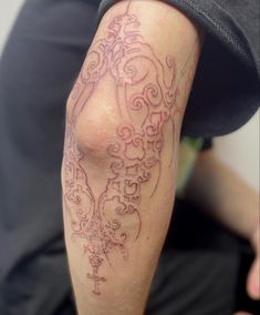 a person with a tattoo on their leg