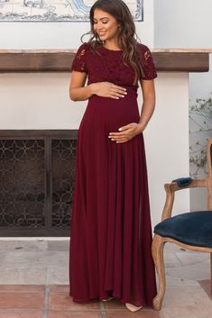 A maternity baby shower dress for stylish moms-to-be! A chiffon maternity evening gown featuring a crochet overlay top, short semi-sheer cap sleeves, a cutout open back with a button closure, and a rounded neckline. Dress is double lined to prevent sheerness and also includes a hidden zipper back closure. The Burgundy Crochet Top Open Back Maternity Evening Gown is perfectly bump-friendly! Maternity Evening Gowns, Open Back Evening Gown, Maternity Dress Wedding Guest, Maternity Evening, Maternity Dresses For Baby Shower, Formal Maternity Dress, Pregnancy Clothes, Crochet Overlay, Overlay Top