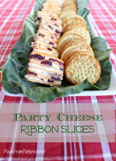 party cheese ribbon slices on a leafy platter with red and white checkered tablecloth