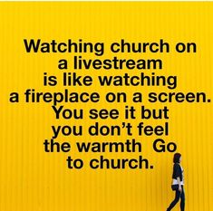 a woman walking past a yellow wall with the words watching church on a livestream is like watching a fireplace on a screen