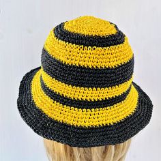 Our Bee crochet hat made of natural fiber - raffia and straw imitation - paper rope yarn. It`s cellulose.  Coziest bucket hat is soft, but sturdy, flexible, light weighted, foldable and washable! It`s a great handmade gift for bee lovers and women any age. Protecting and cooling in hot summer days. more crochet bucket hat here https://etsy.me/3GyieCJ matching yellow crochet bag here https://etsy.me/3ue36p0 Sizes: 6⅞, 7, 7⅛ US, (XS, S, M) for head circumference 22`` (55-57 cm) 7¼, 7⅜ US, (L, XL) for head circumference 23`` (58-59 cm) XXL for big head (60-61 cm) CARE: hand washable in water 40 C. Dry flat. Special designs can be created by combining different colors according to the customer's specifications. Custom orders are welcome! Crochet sun hat produced and packed in non-smoking, pet Crocheted Straw Hat With Short Brim, Short Brim Crochet Straw Hat, Yellow Crochet Beach Hat, Crochet Straw Sun Hat With Curved Brim, Yellow Crochet Bucket Hat For Beach, Yellow Yarn Beach Hat, Yellow Hand Knitted Beach Hat, Handwoven Straw Bucket Hat, Crochet Straw Bucket Hat With Short Brim