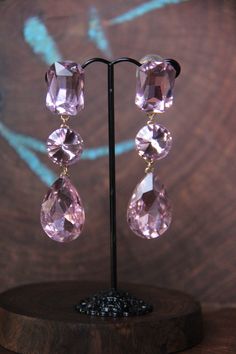 "These fun and stylish large crystal rhinestone earrings are a great statement piece! Pageant, prom, or bridal! Size of earrings: .75\" Wide and 3\" Long. Post type: Large Clip on earrings 4 colors available: Clear Crystal, Royal Blue, Red, Black, Peach/Champagne, Gold, Pink, and AB Also available in piereced post earrings : https://www.etsy.com/your/shops/DesertRoseDesigns10/tools/listings/stats:true/490204987 Looking for the perfect pair of earrings for a special occasion. We specialize in cus Fun Ornaments, Black Peach, Large Crystal, Earrings Clip, Long Red, Red Rhinestone, Earrings Long, Large Crystals, Champagne Gold