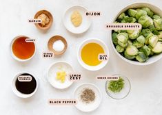 the ingredients for brussel sprouts are shown in bowls on a white surface