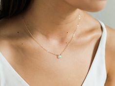 "The most perfect necklace for opal lovers! This dainty necklace includes an authentic Ethiopian Welo opal, around 6-8mm. The chain is available in either 14k gold filled or sterling silver, along with respective clasps/findings. This is the perfect necklace for minimalists. It's great for wearing alone or layering with other necklaces. Wear as a dainty necklace as a pop to any outfit! . . . . . . . . . . . . . . . . . . . . . . . . . . . . . . . . . . . . . . . . . . NECKLACE + Length: 16\" + 2 Dainty Opal Birthstone Necklaces, Delicate Opal Gemstone Necklaces, Dainty Round Opal Necklace, Dainty Opal Pendant Necklace, Dainty Opal Round Pendant Necklace, Minimalist Opal Necklaces With Delicate Chain, Minimalist Opal Necklace With Delicate Chain, Dainty Opal Collar Necklace, Dainty Opal Clavicle Chain Necklace