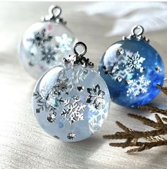 two glass ornaments with snowflakes on them