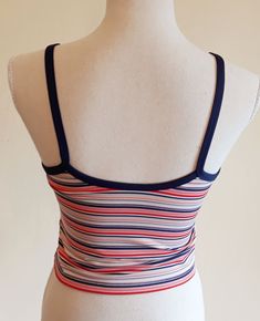 Sweet vintage Champion sports crop top. Colorful stripes,blue suspenders and a edge around the sleeve. It has a logo printed at the end. Fabric is stretchy. It is padded on the chest,see last image. In excellent vintage condition. Tag size: US M,but smaller,best fits to size US XS/S,check the measures. Materials: polyester 88%,spandex 12% Label: Champion  Measures taken flat,one side bust 36.5 - 48 cm = 14,37 - 18,90" waist 34 - 37 cm = 13,38 - 14,57" length with suspenders about 43 cm = 16,93" We will take returns only if there is a problem with condition we did not detected. Please,check the measures before purchasing. All items are vintage in excellent condition with respect to the years. Please write me a message when the package arrives and are you satisfied. Thank you for purchasing Striped Fitted Cropped Top, Fitted Striped Cropped Top, Summer Workout Crop Top, Sporty Cropped Tops With Adjustable Straps, Sporty Fitted Top With Straps, Summer Sports Tops With Contrast Stripes, Summer Sports Top With Contrast Stripes, Spring Striped Sports Tops, Blue Sporty Top With Adjustable Straps