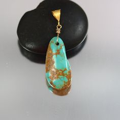 A lovely Kingman Turquoise nugget pendant on gold vermeil bail.  The stone itself is 26 x 12mm.  With the bail it is 1-1/2 inches tall. Turquoise is said to help heal the mind, body, and soul, seen as a good luck charm to help balance your emotions and find spiritual grounding. For the body, it is said to benefit the respiratory, skeletal, and immune system. Spiritual Grounding, Boulder Creek, Luck Charm, Mind Body And Soul, Luck Charms, Kingman Turquoise, Skeletal, Pendant Gold, Body And Soul