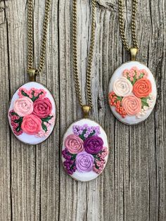 This is a hand embroidered floral pendant necklace made with utmost care and love. It makes for a perfect little gift for a loved one. This unique design is made with 100% cotton fabric and cotton embroidery floss. It is set in an antique bronze frame and comes with a chain length of your preference. Each chain also comes with extension margin of about 1.5 inches.  I offer free shipping within Canada. If you're located in KW region, Ontario I can arrange for a pick up. Orders are sent as standar Bohemian Jewelry With Floral Embroidery For Gifts, Vintage Jewelry With Floral Embroidery For Gift, Floral Embroidered Flower Jewelry For Weddings, Embroidered Pendant Necklace For Gift, Pink Embroidered Jewelry As A Gift, Hand Embroidered Pendant, Hand Embroidered Jewelry, Embroidered Jewelry, Floral Pendant Necklace