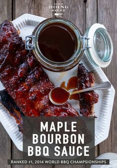 bbq ribs with barbecue sauce on a paper plate next to a jar of ketchup