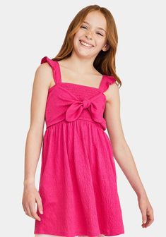 JustFab Pink female Fashion >> Kids >> Girls >> Clothing >> Dresses & Rompers regular Fit: Semi-fitted bodice. Length: Hits above the knee. Fabric: 65% Polyester, 32% Cotton, 3% Spandex. Machine wash cold. Imported. When in doubt, pink is always a good answer! This sweet dress has ruffles at the straps, comfy smocking around the whole bodice, and a faux-tie front for a super-cute look. Smocked Tie Front Dress Pink Dress With Ruffled Tie Straps, Pink Sundress With Square Neck And Tie Straps, Pink Square Neck Sundress With Tie Straps, Pink Square-neck Sundress With Tie Straps, Pink Smocked Dress With Square Neck And Smocked Back, Pink Smocked Dress With Square Neck, Casual Pink Dresses With Ruffled Straps, Cute Summer Sundress With Smocked Bodice, Pink Dress With Bow And Ruffled Straps