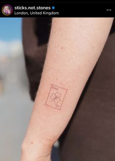 a person with a small tattoo on their arm