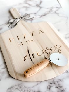 Personalized Pizza Kit, Custom Engraved Pizza Peel, Housewarming Gift Basket, Real Estate Closing Gift Basket, Father's Day Gift for Dad All items are engraved with an industrial grade laser- ensuring they last a lifetime!  Board is 22" x 12" and is made of Poplar Wood Please include the name you would like engraved on the board "Pizza at the ..." will automatically be included unless otherwise specified.  Hello and Welcome to my BRAND NEW SHOP! I have been on Etsy since 2017 running my other sh Personalized Closing Gifts For Buyers, Pizza Kit Gift Basket, Pizza Making Gift Basket, Pizza Basket Ideas Gift, Pizza Gift Basket Ideas, Running Gift Basket, Pizza Gift Basket, Closing Day Real Estate, Closing Gifts For Buyers