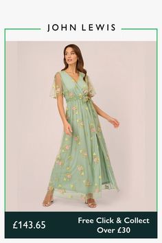 a woman wearing a green dress with flowers on it and the words free click & collect over $ 350