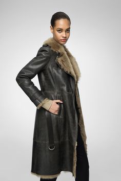 Women's Sheepskin Fur Leather Coat In Coffee Brown Introducing our women's sheepskin fur leather coat in coffee brown. Crafted from genuine sheepskin leather with a semi-aniline finish, this luxurious coat features a faux shearling inner shell for ultimate warmth. The elegant fur collar and open hem cuffs with fur accents add a touch of sophistication. Designed with a belted waist for a flattering fit, it includes one inside pocket and two side pockets for practicality. The rich coffee brown color enhances its timeless appeal. Outer Shell: Genuine Leather Leather Type: Sheepskin Leather Finish: Semi-aniline Inner Shell: Faux Shearling Feature: Belted Waist Closure Style: Zipper Collar Style: Fur Collar Cuffs Style: Open Hem With Fur Inside Pockets: One Outside Pockets: Two Side Pockets Col Coats 2024, Long Camel Coat, Shearling Coat Womens, Mens Leather Shirt, Coffee Brown Color, Suede Jacket Men, Coat With Fur Collar, Leather Shorts Women, Short Leather Skirts