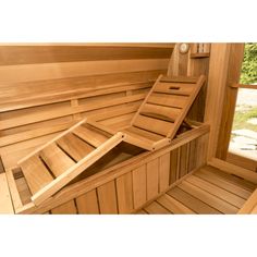 the inside of a wooden sauna with two benches