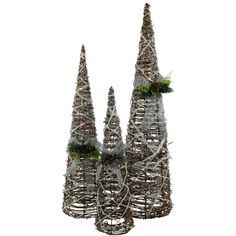 three christmas trees made out of twigs and branches with evergreens on the top, in front of a white background