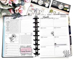 an open planner with flowers on it