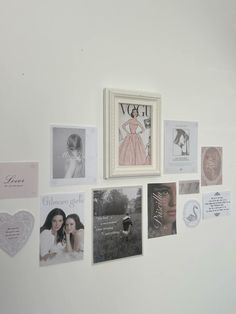 there are many pictures on the wall with hearts and other things attached to the wall