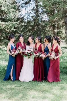 a bride and her bridals standing in the grass