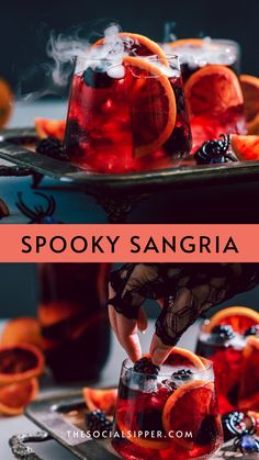 the spooky sangria cocktail is garnished with orange slices and blackberries