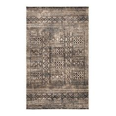 a black and white rug with an intricate design on the bottom, in front of a white background