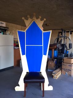 a chair that has been made to look like a blue and white building with a crown on it