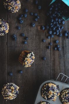 blueberry muffins and fresh blueberries on a wooden table