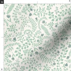 a white and green floral print fabric