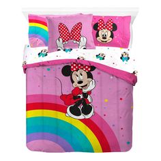 minnie mouse bedding set with polka dots and rainbows in the background, on a white