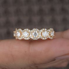 a diamond ring is shown in the palm of someone's hand, with three diamonds on it