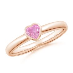 Make a promise of love and care with this heart pink sapphire solitaire ring. The pink sapphire is bezel set on a lustrous 14k rose gold band and captures attention with its blossomy hue. Sapphire Promise Rings, Sapphire Solitaire Ring, Sapphire Rings, Sapphire Solitaire, Solitaire Setting, Pink Sapphire Ring, Rose Gold Band, Jewelry Inspo, Gold Band