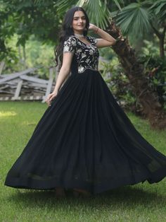 Introducing our stunning "black embroidered georgette reception wear gown" that is sure to make you stand out at any event or function. This black gown features exquisite sequin and embroidered work, adding a touch of elegance and glamour to your look. Crafted from high-quality georgette fabric, this gown is the perfect choice for those special occasions when you want to look and feel your best.
This black reception wear gown is that it comes fully stitched, saving you the hassle of alterations Semi-stitched Embellished Black Anarkali Set, Black Floor-length Gown For Party, Bollywood Style Sequined Georgette Dress, Anarkali Evening Dress With Resham Embroidery For Reception, Formal Anarkali Lehenga With Sequins, Evening Anarkali Set With Intricate Embroidery, Anarkali Zari Work Evening Dress, Anarkali Evening Dress With Zari Work, Evening Lehenga With Resham Embroidery In Maxi Length