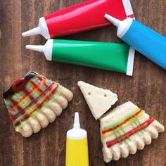 three toothbrushes and some food on a table