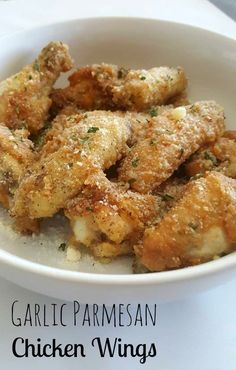 garlic parmesan chicken wings in a white bowl