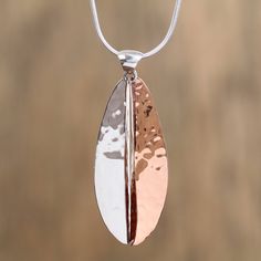 Rippling like lake waters a modern leaf is crafted by hand of sterling silver and copper with a hammered finish. Mexican artisan Guillermo Arregui works in the time-honored tradition of Taxco silversmithing to create this beautiful pendant necklace. The leaf pendant is formed of two pieces that dangle separately. Hammered Copper Jewelry, Modern Silver Earrings, Beautiful Pendant Necklace, Silver Dangle Earrings, Copper Pendant, Sterling Silver Dangle Earrings, Copper Necklace, Copper Pendants, Leaf Pendant