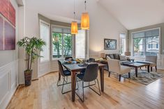 a living room with hardwood floors and white walls