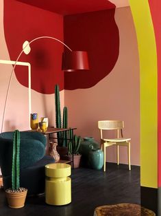 a living room filled with furniture and colorful walls