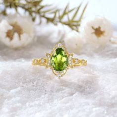 ✥ 𝐌𝐚𝐢𝐧 𝐒𝐭𝐨𝐧𝐞 𝐃𝐞𝐭𝐚𝐢𝐥𝐬 ↣ Shape: Pear Cut ↣ Type: ( Peridot ) ↣ Weight: 1.5 Ct (App.) ↣ Dimension: 6.00*8.00MM MM (App.) ↣ Color: Green ↣ Options: Lab Grown Gem and Natural Gem  (Possible on request while placing an order and Extra Chargeable Service) ✥ 𝐒𝐢𝐝𝐞 𝐒𝐭𝐨𝐧𝐞 𝐃𝐞𝐭𝐚𝐢𝐥𝐬 ↣ Shape: Brilliant Cut ↣ Type: ( Moissanite ) ↣ Weight: 0.15 Ct (App.) ↣ Color/Clarity: Colorless / VVS-VS ↣ Options: Lab Grown Diamond and Natural Diamond (Possible on request while placing an orde Lime Green Fine Jewelry With Center Stone, Elegant Peridot Diamond Ring, Peridot Birthstone Diamond Ring Fine Jewelry, Yellow Gold Peridot Jewelry With Halo Setting, Gold Peridot Diamond Ring For May Birthstone, Peridot Birthstone Ring For Anniversary, Fine Jewelry Peridot Birthstone Ring For Anniversary, Elegant Lime Green May Birthstone Ring, Gold Peridot Birthstone Ring With Accent Stones