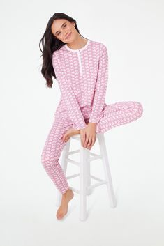 Give yourself a chance to unwind and relax in the cozy comfort of our Hathi Pajamas. This set includes a long-sleeve henley-style top and matching bottoms, each crafted entirely from the softest cotton and embellished with a unique color twist on our original classic and playful elephant print. 4 Snaps Elastic Waistband Super-Smooth Flatlock Seams Materials and Care 100% Premium Cotton Cold Wash, with like colors. Do not bleach Tumble dry low (Line dry recommended). Warm iron if needed Imported Color Twist, Roller Rabbit, Elephant Print, Sleepwear & Loungewear, Classic Pattern, Comforters Cozy, Unique Colors, Pink Color, Top Styles