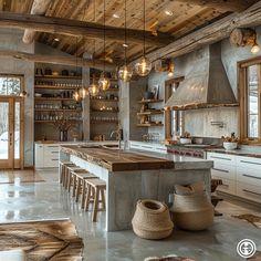 a large kitchen with lots of counter space and hanging lights