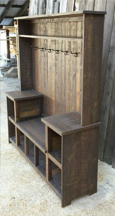 an old wooden bench with two benches underneath it and some shelves below the bench that are made out of wood