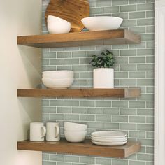 some shelves with bowls and plates on them